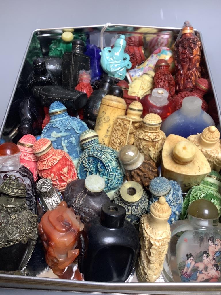 A group of approximately forty Chinese snuff bottles